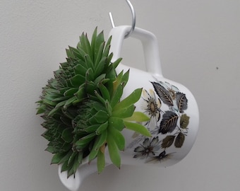 Pretty hanging basket/planter made from Johnson Bros milk jugs/creamers with floral design. Perfect for succulents or hanging plants.