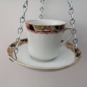 Beautiful bone china indoor or outdoor tea cup hanging basket/planter.  Made from Leigton &quot;Astoria&quot; tea cup and saucer with gold detail.