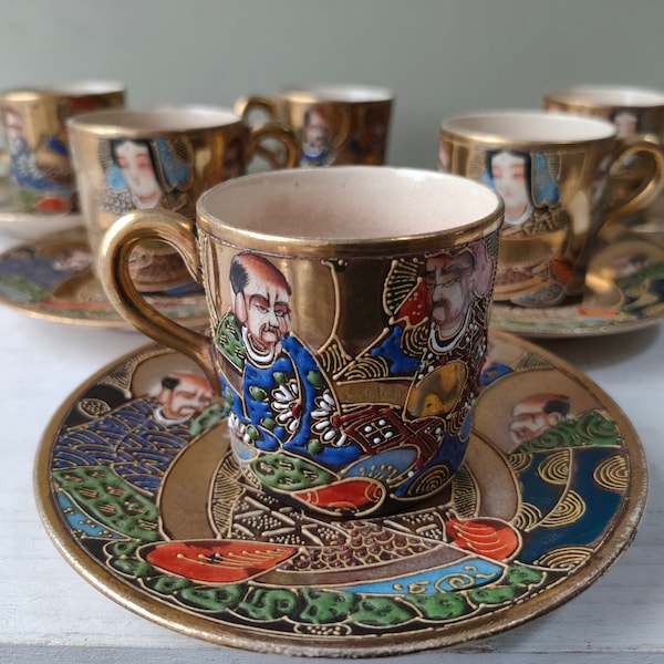 Lovely set of 6 Japanese Satsuma Moriage Gold Coffee cups and saucers. Set showing Immortals  and Kannon, Goddess of peace. Lovely gift.