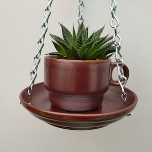 Lovely ceramic indoor or outdoor tea cup hanging basket/planter. Made from vintage Thomas, Germany Kiruna china tea cup and saucer.