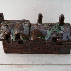 Rare pottery money box in the shape of a Tudor hatched cottage. Gorgeous brown, cream and turquoise drip glaze. Still with original stopper.
