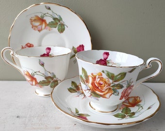 Tea for 2! Gorgeous pair of Vintage teacups and saucers in beautiful rose pattern. Fine bone china with gold detail. Lovely gift.