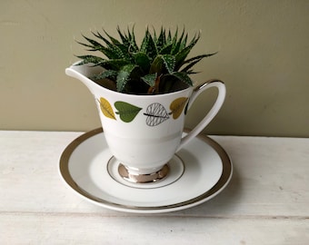 Gorgeous creamer planter made from Windsor Bone China creamer and platinum saucer. Perfect for Cactus/house plant. Lovely gift!