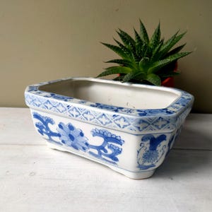Lovely 7" pottery rectangular planter or vase with blue and white oriental floral decoration. Perfect for flower arranging. A lovely gift.