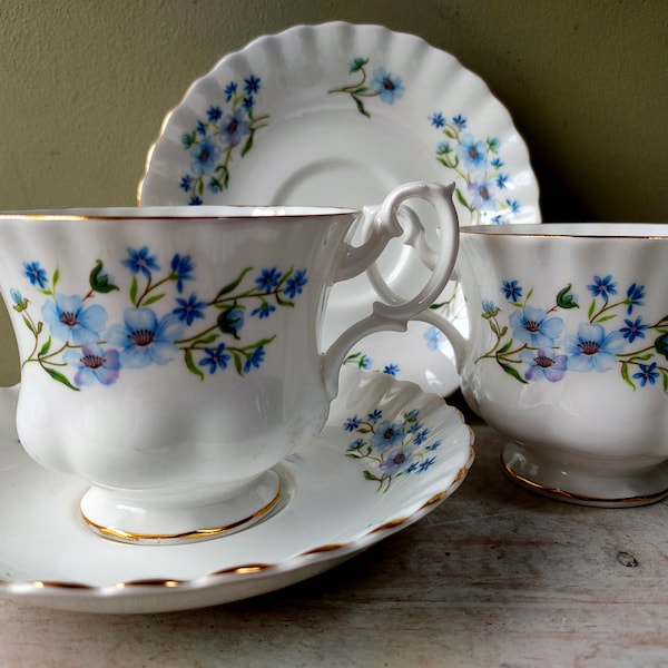 Pretty pair of  Richmond "Blue Rock" vintage Bone China teacups and saucers. Blue floral pattern with gold detail. Lovely gift.