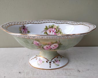 Gorgeous 8 1/4" footed pedestal bowl with pierced decoration. Pink roses and gold detail. Lovely gift.