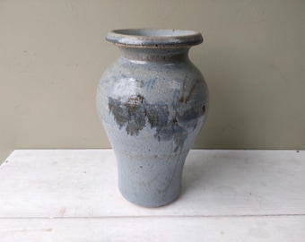 Lovely Studio Pottery 7 1/2" vase with abstract floral design and blue glaze. Stylish hand painted vintage piece. Lovely gift!