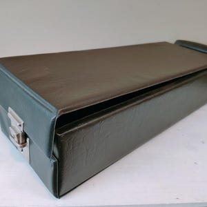 Vintage tape cassette storage carry case in black with chrome fittings. Perfect gift for music collectors. Music storage/organisation.