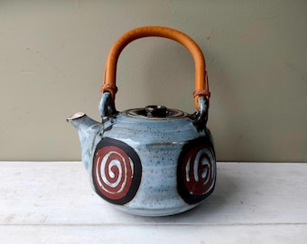 Beautiful vintage Briglin Pottery Teapot with swirl pattern and bamboo handle. Hand painted studio pottery. Lovely gift.
