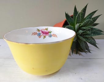 Lovely vintage sugar bowl by Balfour Royal Crown Pottery. Vibrant yellow exterior, bone china, gold detail. Lovely gift.