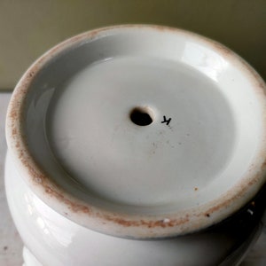 May include: White ceramic planter with a drainage hole and a black mark on the bottom that says "4".