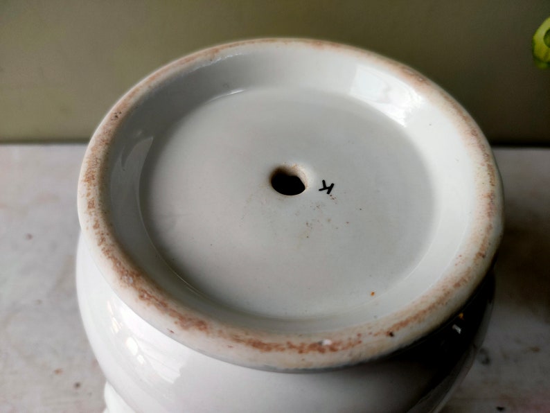 May include: White ceramic planter with a drainage hole and a black mark on the bottom that says "4".