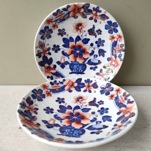 Gorgeous pair of Antique 5 3/4" saucers/dishes in cobalt blue, red and gold luster. Flow Blue Imari pattern. C19th transferware porcelain.