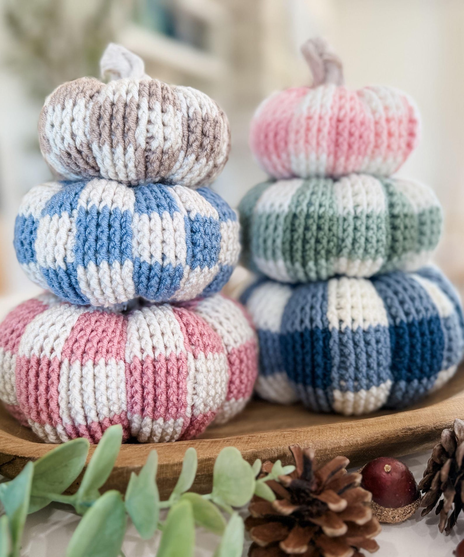 Crochet pumpkin stacks in blue, pink, green and neutral gingham checks