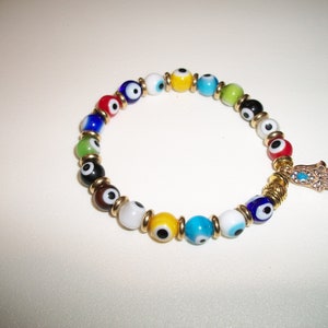 Multi-Colored Evil eye bracelet with gold toned brass and CZ Hamsa evil eye charm.