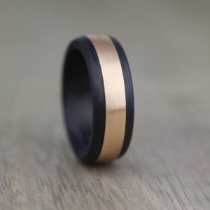 Black and rose gold wedding ring band for men. Court shape with a brushed/matt finish. Comfort fit hard wearing ring