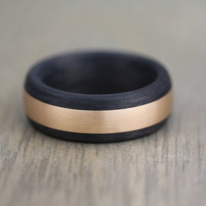 Black and rose gold wedding ring band for men. Court shape with a brushed/matt finish. Comfort fit hard wearing ring