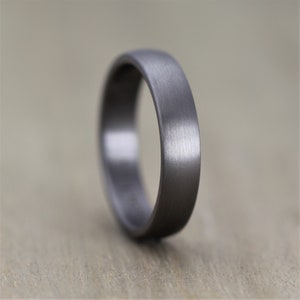 slim tantalum wedding ring for men and woman court profile Tantalum wedding ring band. Mans wedding ring in gunmetal grey. 6mm wide with a heavy brushed finish and engravable inside