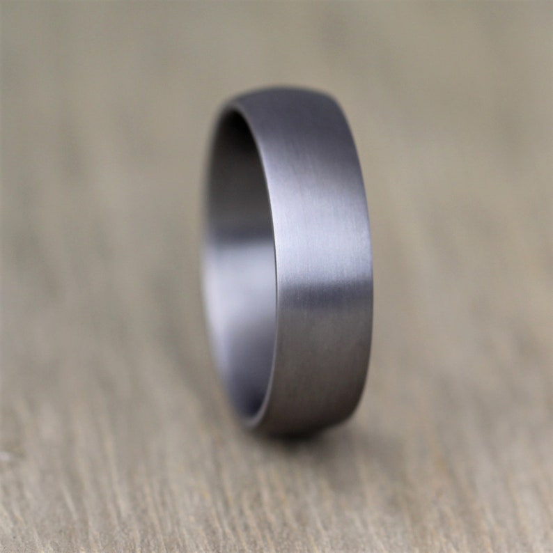 court profile Tantalum wedding ring band. Mans wedding ring in gunmetal grey. 6mm wide with a heavy brushed finish and engravable inside men's wedding band in this alternative metal. made in the UK