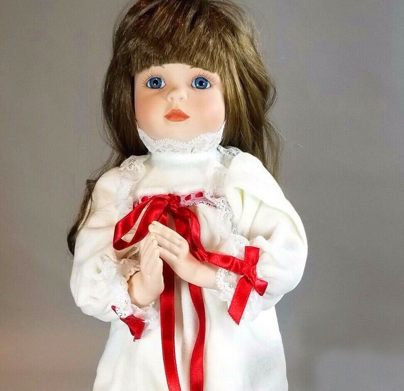 a christmas prayer porcelain doll