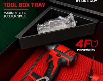 May include: A black triangular tool box tray with text reading STANDARD TOOL BOX TRAY, MAXIMIZE YOUR TOOLBOX SPACE, MADE IN OHIO BY ONE GUY, and 4F PRINTWORKS. The tray contains a clear plastic bag and sits above a red textured tool mat.
