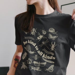 Be Kind To All Kinds Unisex Jersey Short Sleeve Tee | cottage core, butterfly, lady bug, wellness, growth, no hate, be kind, bugs, critters