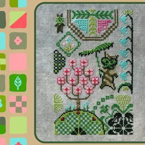 May include: Cross-stitch embroidery depicting a whimsical scene with a green creature holding an umbrella, a pink flowering tree, and a vine of blue flowers. The design is stitched on a white linen fabric.
