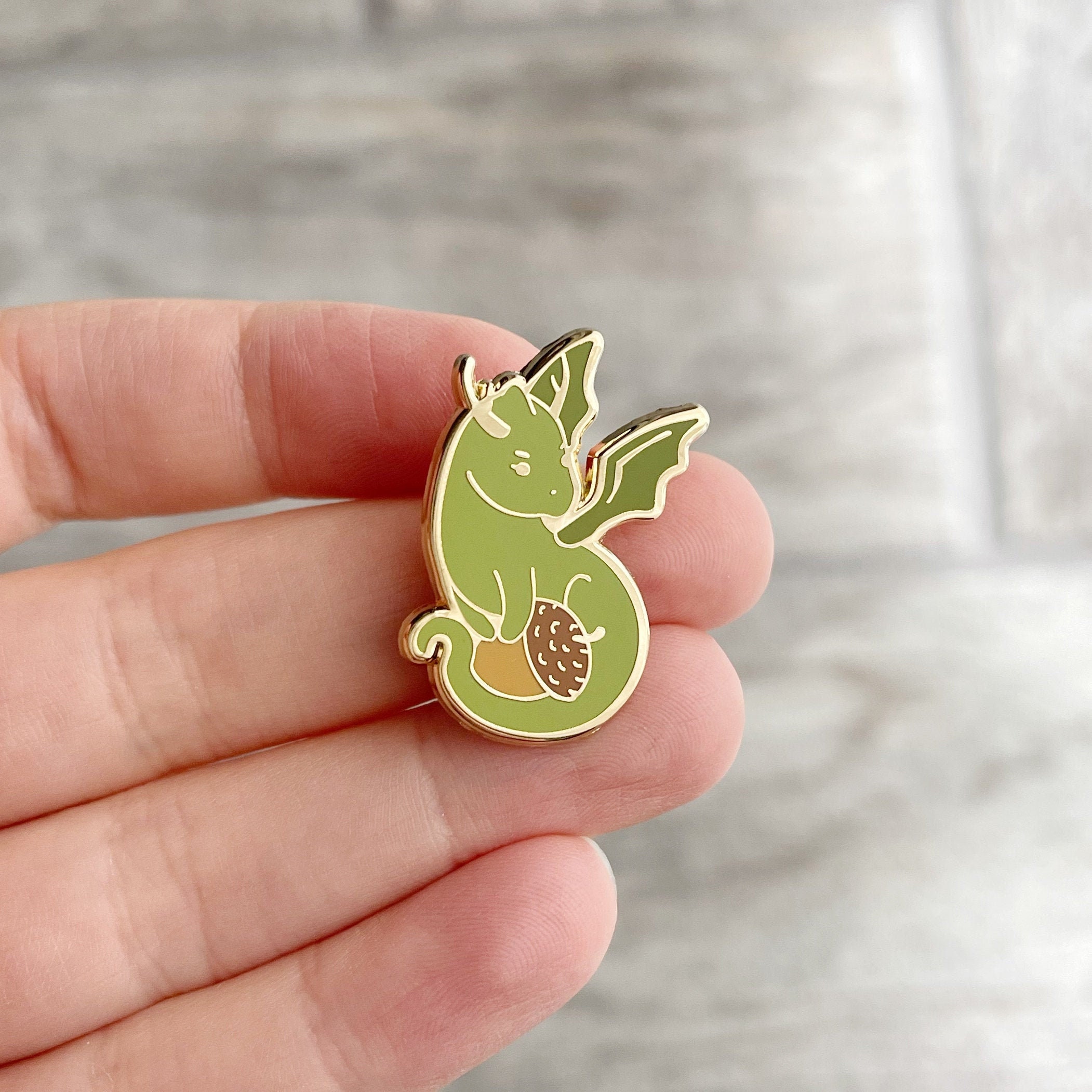 Acorn hoarding tiny dragon - Tiniest Hoard - Hard enamel pin