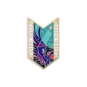 May include: Gold-colored enamel pin with a blue, purple, and pink design of a gun in space. The words "GUNSLINGER" are on either side of the pin.
