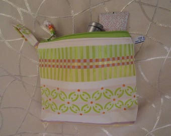 pencil case in jacquard satin cotton fabric, ecru with green, orange and gold designs, lined in yellow