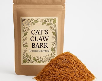 May include: A brown paper bag of Cat's Claw Bark (Uncaria tomentosa) with a decorative label featuring floral elements. A pile of dried, shredded bark is in front of the bag. The text on the label reads "CAT'S CLAW BARK".
