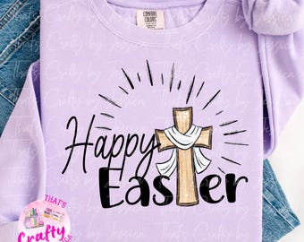 May include: A lavender sweatshirt with the text "Happy Easter" in black lettering. A brown wooden cross with a white ribbon is centered on the sweatshirt.
