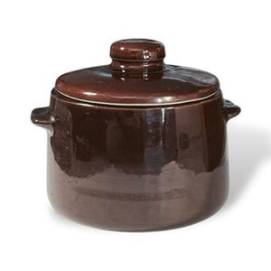 May include: A dark brown ceramic pot with a matching lid and two small side handles. The pot features a smooth, glossy finish and a cylindrical body shape. The lid has a small knob handle at the center, and the overall design is simple and functional.