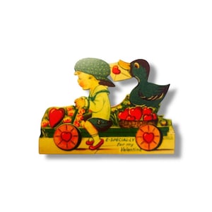May include: Vintage Valentine's Day card featuring a child driving a cart filled with hearts and flowers. A duck carries a letter. The card has the text "E-SPECIAL-LY for my Valentine."