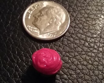 Chocolate mini cupcake with cherry frosting
