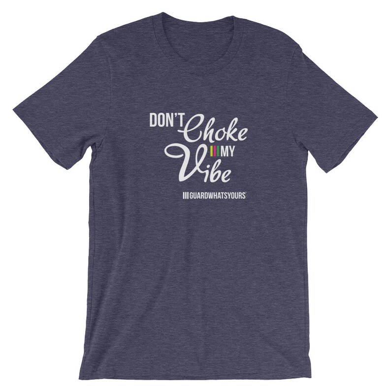 May include: A navy blue t-shirt with the text "Don't Choke My Vibe" in white with a colorful stripe design. The text "#GUARDWHATSYOURS" is also printed in white below the main text.