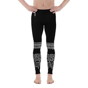 May include: Black leggings with a white geometric pattern on the lower legs. The pattern includes a series of overlapping ovals and lines, with the text "ME" repeated in a stylized font.