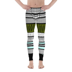 May include: Black and white patterned leggings with green, white, and blue accents. The leggings have a geometric design.