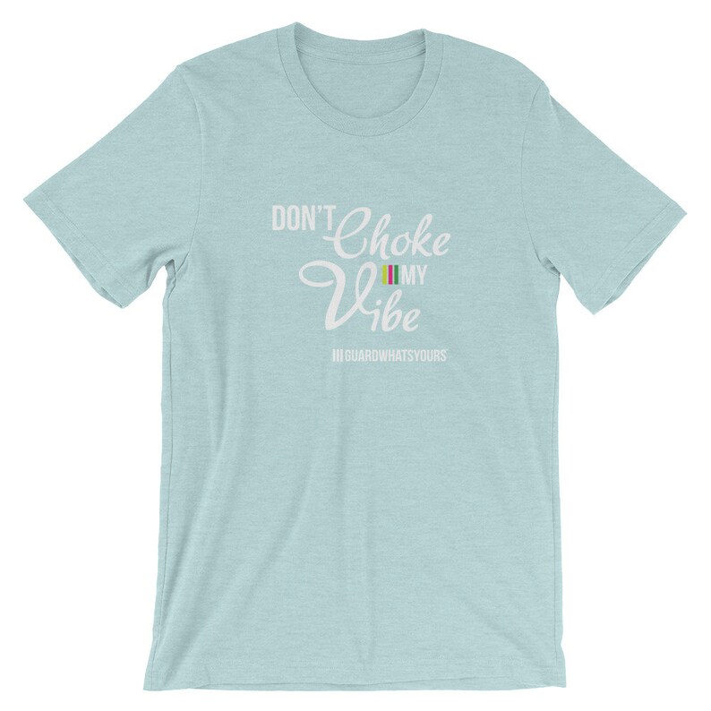 May include: A light blue t-shirt with the text "Don't Choke My Vibe" in white. The text "#GUARDWHATSYOURS" is also in white below the main text.