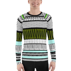 May include: A long-sleeved shirt with a geometric pattern in black, white, green, and light blue. The pattern is made up of various shapes, including triangles, circles, and lines.
