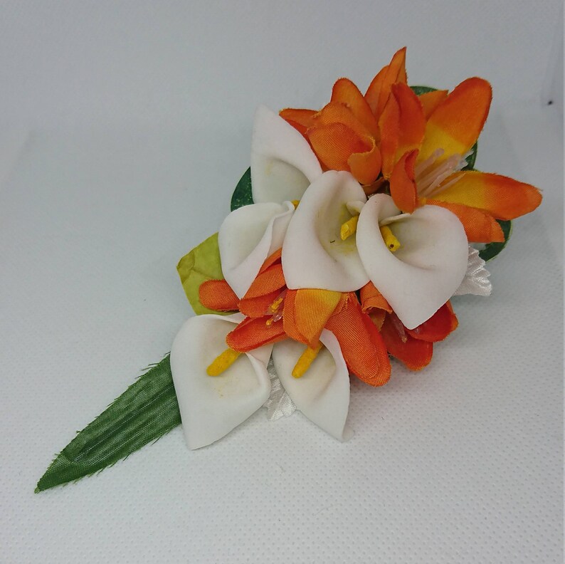 Ladies White cala and orange lapelwristhandbag corsage