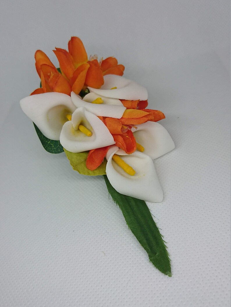 Ladies White cala and orange lapelwristhandbag corsage