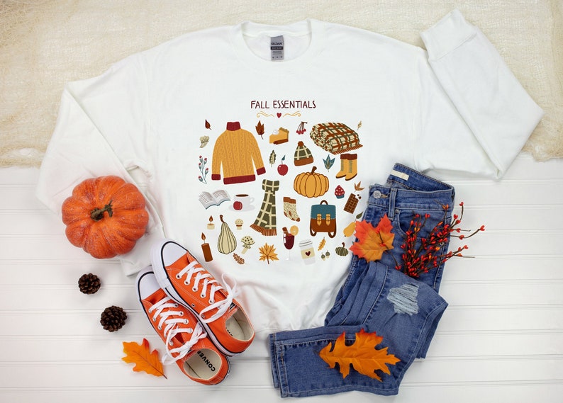 Unique Fall Essentials sweatshirt. Autumn hoodie with orange pumpkin, cozy sweater, fall leaves art for her. Unique womens fall sweatshirt.