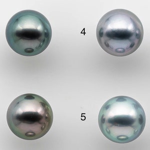 May include: Nine round, iridescent black pearls with varying shades of green and blue. The pearls are arranged in three rows of three, numbered 1-9.