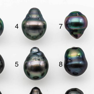 May include: Nine black Tahitian pearls with iridescent green and blue hues. The pearls are arranged in three rows of three, numbered 1 through 9.