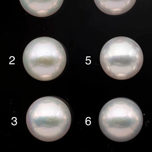 May include: Nine white pearls arranged in three rows of three, numbered 1 through 9.