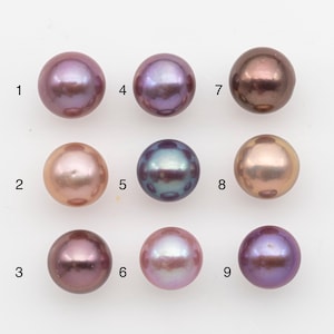 May include: Nine lustrous, round pearls in various colours, including shades of pink, purple, and bronze. The pearls are arranged in a grid, showcasing their smooth surfaces and iridescent qualities. Ideal for jewellery making.
