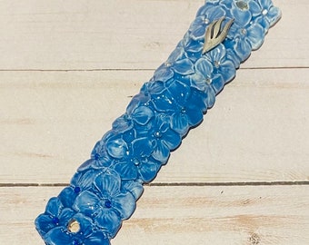 Blue Floral Mezuzah Case with Silver Shin and Bejewelled Flowers.