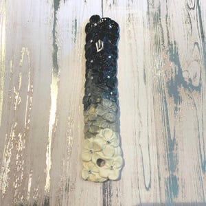 Black and White Mezuzah Case with Silver Shin and Bejewelled Flowers.