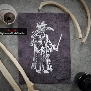 May include: A black and white illustration of a plague doctor with a long beak mask. The text "LOST HIS MIND CLINICALLY FINE" is printed around the figure. The illustration is printed on a dark gray fabric.